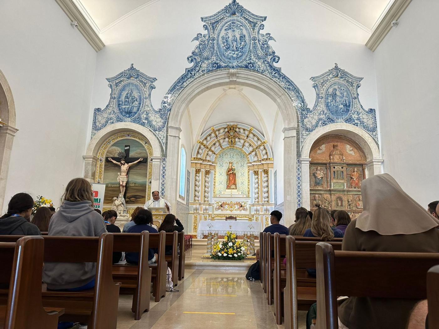 Eucaristía en honor a la Patrona de la ciudad que acoge a algunos malagueños